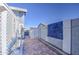 Brick paved pathway with decorative wall and storage shed at 8021 W Charter Oak Rd, Peoria, AZ 85381