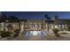 Private backyard oasis with a stunning pool at night at 8408 E La Senda Dr, Scottsdale, AZ 85255