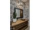 Bathroom with stone feature wall, vessel sink, and wooden vanity at 8408 E La Senda Dr, Scottsdale, AZ 85255