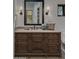 Elegant bathroom with a dark wood vanity and large mirror at 8408 E La Senda Dr, Scottsdale, AZ 85255