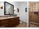 Elegant bathroom with a walk-in shower, tiled floors and modern vanity at 8408 E La Senda Dr, Scottsdale, AZ 85255