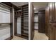 Large walk-in closet with ample shelving and hanging space at 8408 E La Senda Dr, Scottsdale, AZ 85255