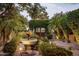 Charming courtyard entry with fountain and lush landscaping at 8408 E La Senda Dr, Scottsdale, AZ 85255