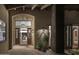 Inviting entryway with rustic beams and a grand wooden door at 8408 E La Senda Dr, Scottsdale, AZ 85255