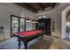 Game room includes a pool table and built-in shelving at 8408 E La Senda Dr, Scottsdale, AZ 85255