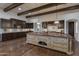 Gourmet kitchen boasts a large island and dark wood cabinetry at 8408 E La Senda Dr, Scottsdale, AZ 85255