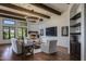 Bright living room with hardwood floors, fireplace, and built-in shelving at 8408 E La Senda Dr, Scottsdale, AZ 85255