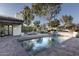 Relaxing pool area with a fire pit and lush landscaping at 8408 E La Senda Dr, Scottsdale, AZ 85255