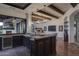 Home wet bar with wine cooler and dark wood cabinetry at 8408 E La Senda Dr, Scottsdale, AZ 85255