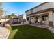 Artificial turf backyard with pergola and patio seating at 904 E Zesta Ln, Gilbert, AZ 85297