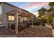 Backyard patio with pergola, seating area, and artificial turf at 904 E Zesta Ln, Gilbert, AZ 85297