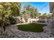 Landscaped backyard with artificial turf and pergola at 904 E Zesta Ln, Gilbert, AZ 85297