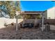 Circular patio with pergola, seating area, and decorative accents at 904 E Zesta Ln, Gilbert, AZ 85297