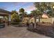 Artificial turf backyard with pergola, seating area, and brick patio at 904 E Zesta Ln, Gilbert, AZ 85297