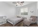 Cozy bedroom with a comfortable bed and a relaxing chaise lounge at 904 E Zesta Ln, Gilbert, AZ 85297