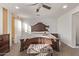 Bright bedroom featuring a wooden bed frame and natural light at 904 E Zesta Ln, Gilbert, AZ 85297