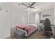 Comfy bedroom with a gray bedspread and brick-patterned walls at 904 E Zesta Ln, Gilbert, AZ 85297