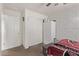 Bright bedroom with double door closet and brick accent wall at 904 E Zesta Ln, Gilbert, AZ 85297