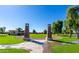 Entrance to community park with stone pillars and green space at 904 E Zesta Ln, Gilbert, AZ 85297