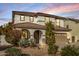 Two-story house with a large driveway and landscaped front yard at dusk at 904 E Zesta Ln, Gilbert, AZ 85297