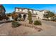 Two-story house with a landscaped yard, driveway, and basketball hoop at 904 E Zesta Ln, Gilbert, AZ 85297