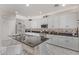 Modern kitchen with white cabinets, granite countertops, and an island at 904 E Zesta Ln, Gilbert, AZ 85297