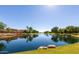 Serene lakefront view with lush landscaping and homes at 904 E Zesta Ln, Gilbert, AZ 85297