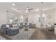 Bright living room showcasing a sectional sofa and wood-look floors at 904 E Zesta Ln, Gilbert, AZ 85297