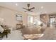 Light and airy living room with hardwood floors, a fireplace, and large windows at 904 E Zesta Ln, Gilbert, AZ 85297