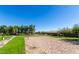 Beach volleyball court with net and surrounding landscaping at 904 E Zesta Ln, Gilbert, AZ 85297