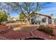 Landscaped backyard with gravel and mature trees at 917 E Betsy Ln, Gilbert, AZ 85296