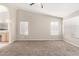 Bright bedroom with neutral wall tones, carpeting, and a ceiling fan at 917 E Betsy Ln, Gilbert, AZ 85296