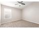 Well-lit bedroom, ceiling fan, and window coverings at 917 E Betsy Ln, Gilbert, AZ 85296