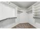 Large walk-in closet with custom shelving and hanging rods at 917 E Betsy Ln, Gilbert, AZ 85296