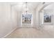 Dining room features a large window and wood-look tile floors at 917 E Betsy Ln, Gilbert, AZ 85296