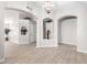 Bright and airy entryway with tile flooring and decorative niches at 917 E Betsy Ln, Gilbert, AZ 85296