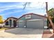 House exterior with a three-car garage and landscaping at 917 E Betsy Ln, Gilbert, AZ 85296