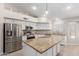 Kitchen with granite island and stainless steel appliances at 917 E Betsy Ln, Gilbert, AZ 85296