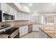 Kitchen features granite countertops, stainless steel appliances, and white cabinetry at 917 E Betsy Ln, Gilbert, AZ 85296