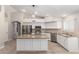 Spacious kitchen with granite island, stainless steel appliances, and white cabinets at 917 E Betsy Ln, Gilbert, AZ 85296