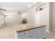 Kitchen island overlooks living room with a cozy fireplace at 917 E Betsy Ln, Gilbert, AZ 85296