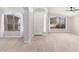 Spacious living room with large windows and wood-look tile at 917 E Betsy Ln, Gilbert, AZ 85296