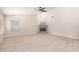 Living room with fireplace and tile flooring, featuring a ceiling fan at 917 E Betsy Ln, Gilbert, AZ 85296