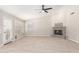 Living room with fireplace and tile flooring, featuring a ceiling fan at 917 E Betsy Ln, Gilbert, AZ 85296