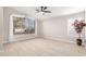 Living room featuring wood-look floors and a ceiling fan at 917 E Betsy Ln, Gilbert, AZ 85296