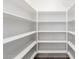 Bright walk-in pantry with ample shelving for storage at 917 E Betsy Ln, Gilbert, AZ 85296