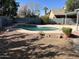 Inviting kidney-shaped pool in a backyard with desert landscaping at 917 E Betsy Ln, Gilbert, AZ 85296