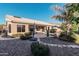 Landscaped backyard oasis with a pebble pathway leading to the pool at 9345 E Hobart St, Mesa, AZ 85207