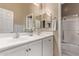 Clean bathroom with double sinks and a shower/tub combo at 9345 E Hobart St, Mesa, AZ 85207