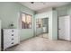 Bedroom with mirrored closet doors and tile floors at 9345 E Hobart St, Mesa, AZ 85207